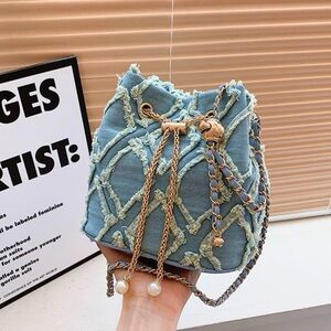 Capri Boutique Pearl Frayed Blue Denim Drawstring Bucket Bag